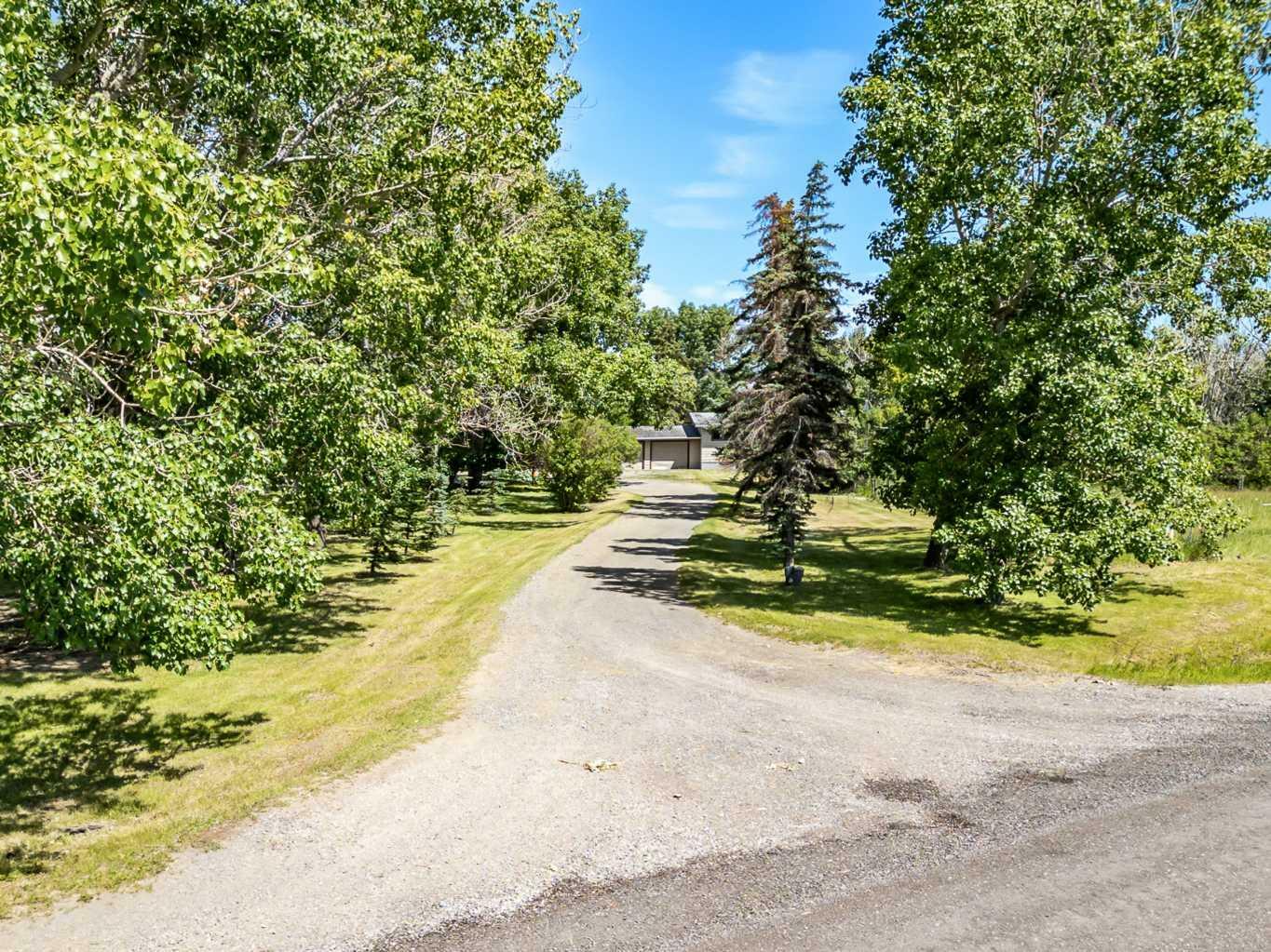 Property Photo: 322140 1048 Drive E AB T1S 4T1