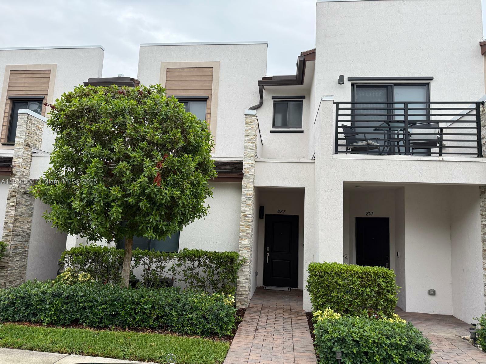 Property Photo: 887 NE 211th St FL 33179