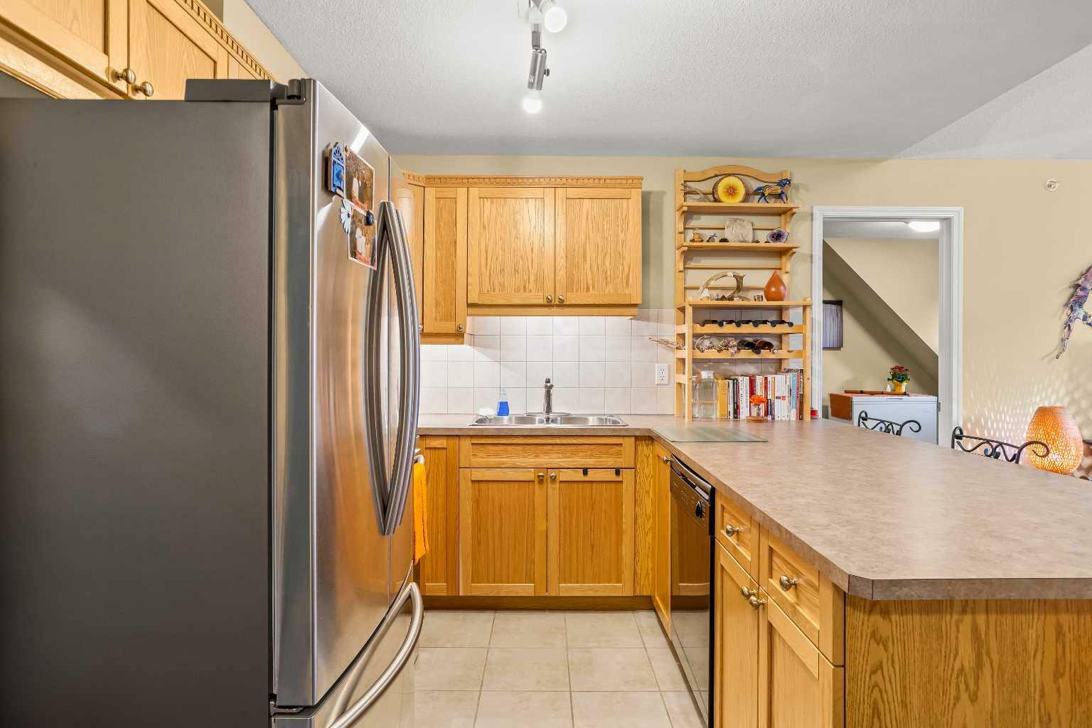 Property Photo: 186 Kananaskis Way NW 408 AB T1W 1R6