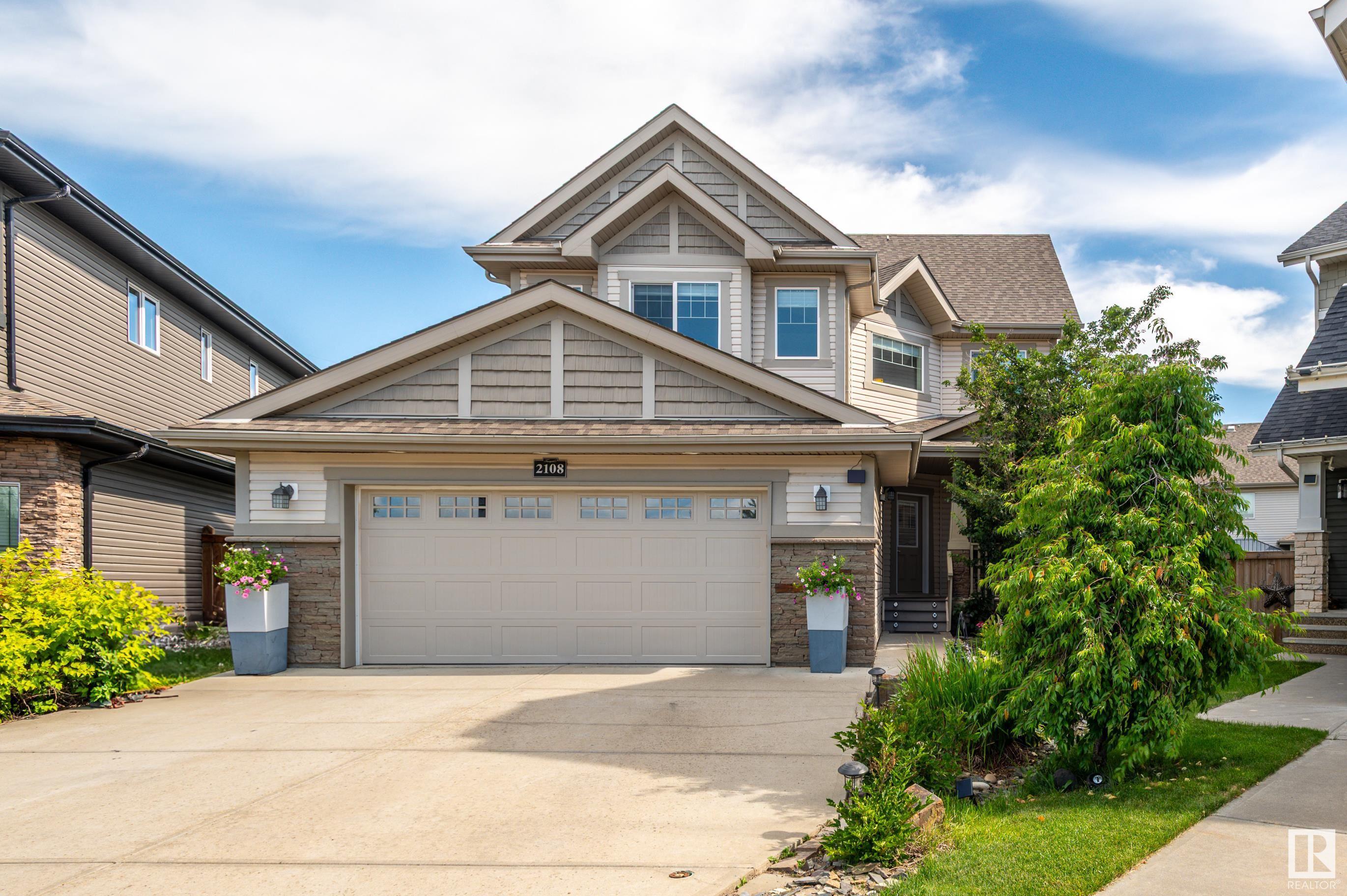 Property Photo: 2108 Trumpeter Way NW AB T5S 0G1