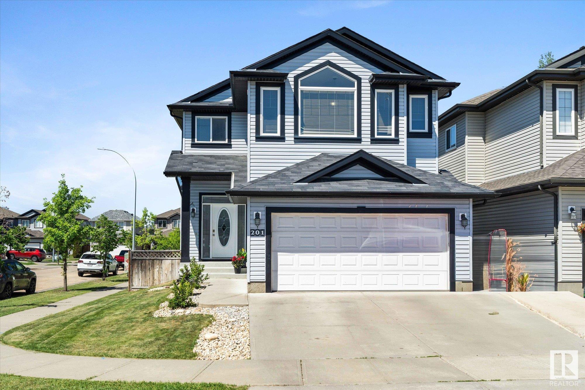 Property Photo: 201 Woodbend Way AB T8L 0B8