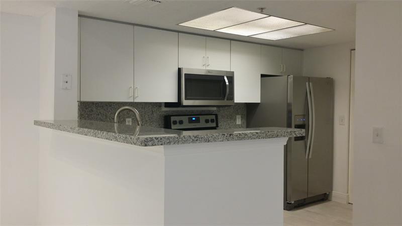 Property Photo: 5031 Wiles Rd 207 FL 33073