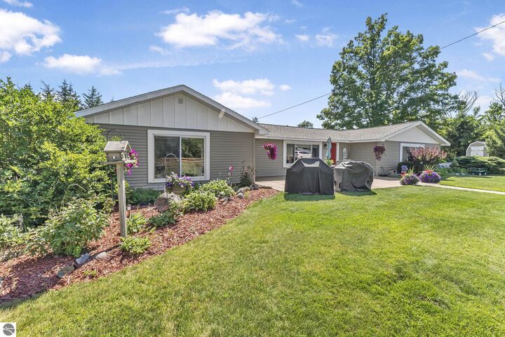 Property Photo:  78 13 Mile Road  MI 49665 