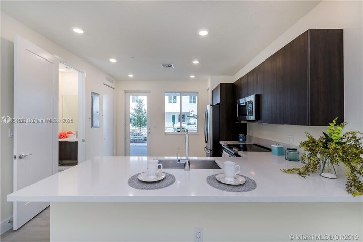 Property Photo:  10226 NW 64th Ter 105  FL 33178 