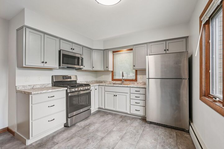 Property Photo:  9707 W Metcalf Pl 9711  WI 53222