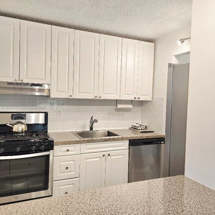 Property Photo:  135 NE 202nd Ter N18  FL 33179 