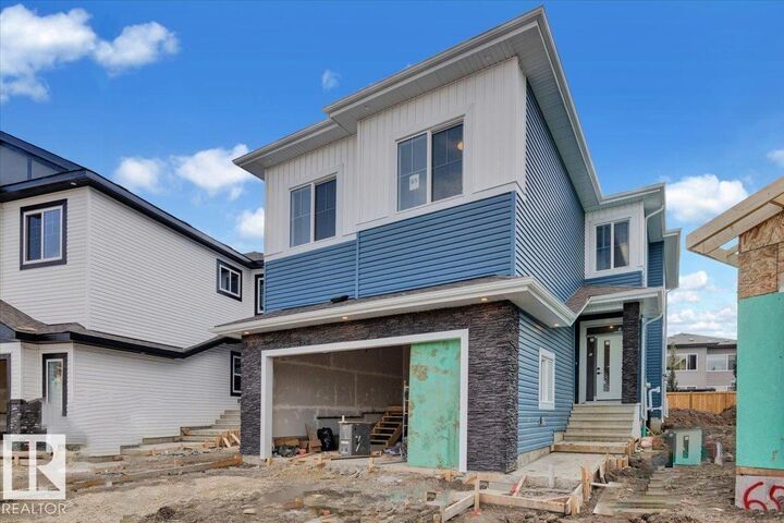 Property Photo:  65 Blackbird Bend  AB T8L 0G6 