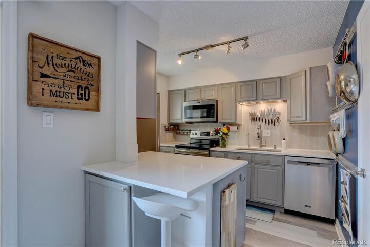 Property Photo:  3825 S Monaco Parkway 128  CO 80237 