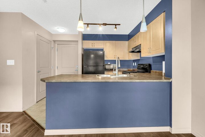 Property Photo: 11441 Ellerslie Road SW 305 AB T6W 1S9
