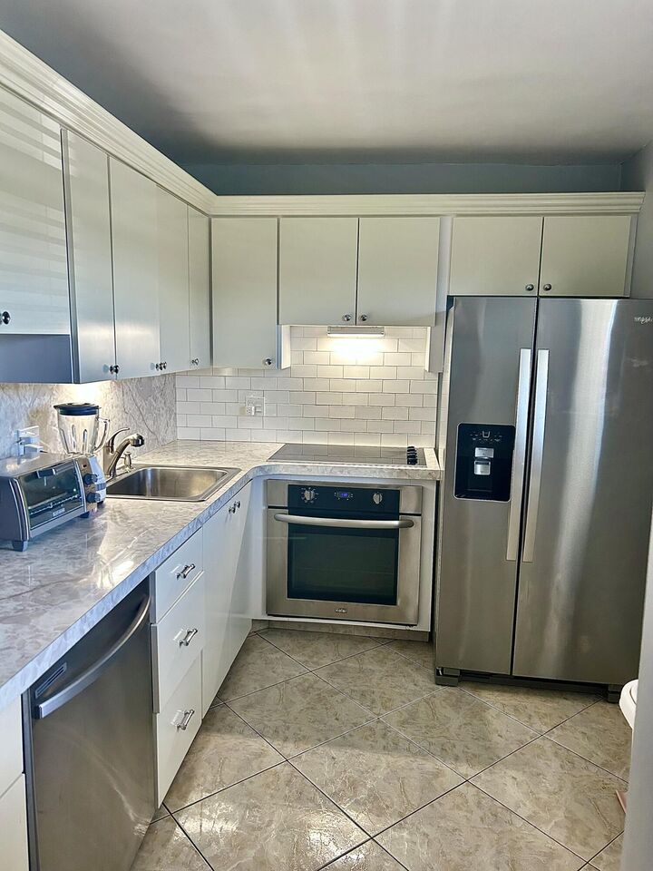 Property Photo:  2600 NE 1st Lane 205  FL 33435 