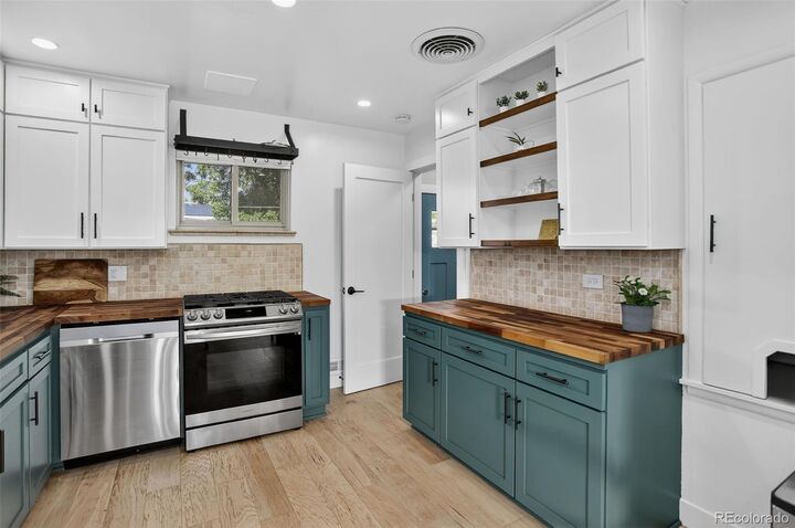 Property Photo:  1981 S Wolff Street  CO 80219 