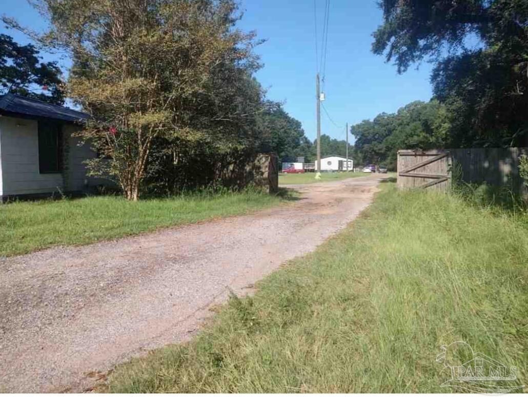 Property Photo:  10121 Chemstrand Rd  FL 32514 