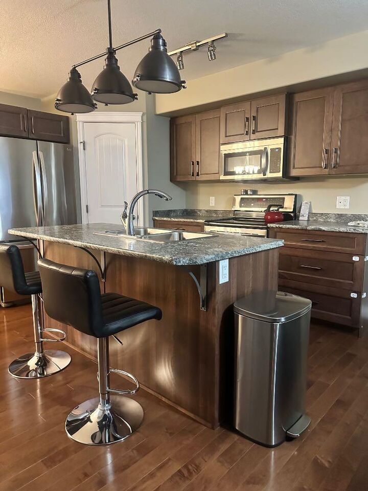 Property Photo:  221 Callen Drive  AB T9K 0X7 