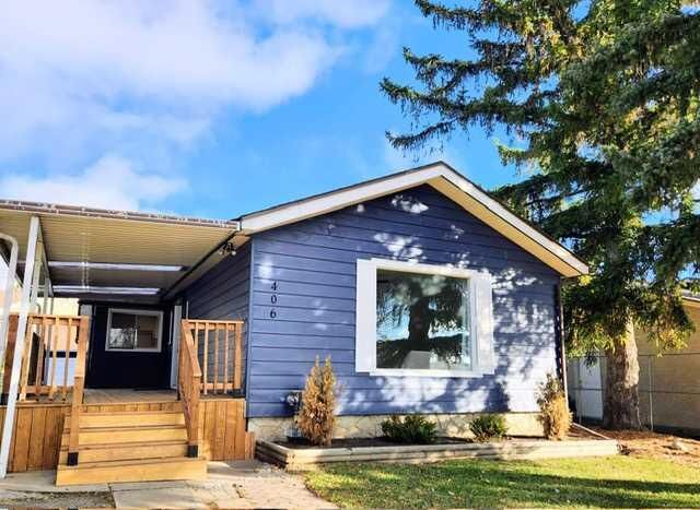Property Photo:  406 8 Avenue SE  AB T1V 1J3
