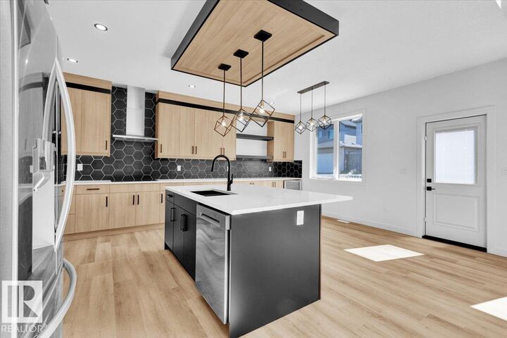 Property Photo: 1119 Gyrfalcon Crescent NW AB T5S 0S5