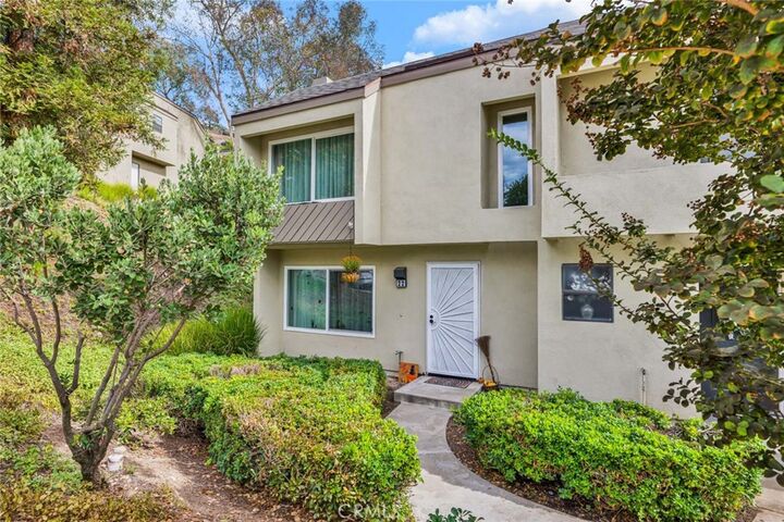 Property Photo:  177 N Singingwood Street 22  CA 92869 
