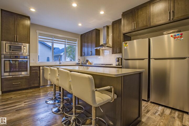 Property Photo:  9868 206 Street NW  AB T5T 7L5