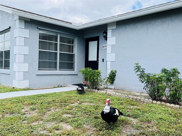 Property Photo:  6111 Rainbow Circle  FL 33463