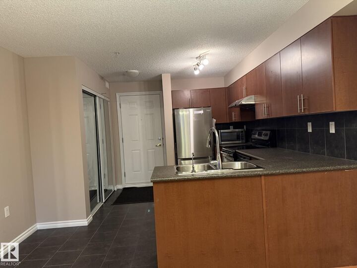 Property Photo: 10118 106 Avenue NW 303 AB T5H 0B8