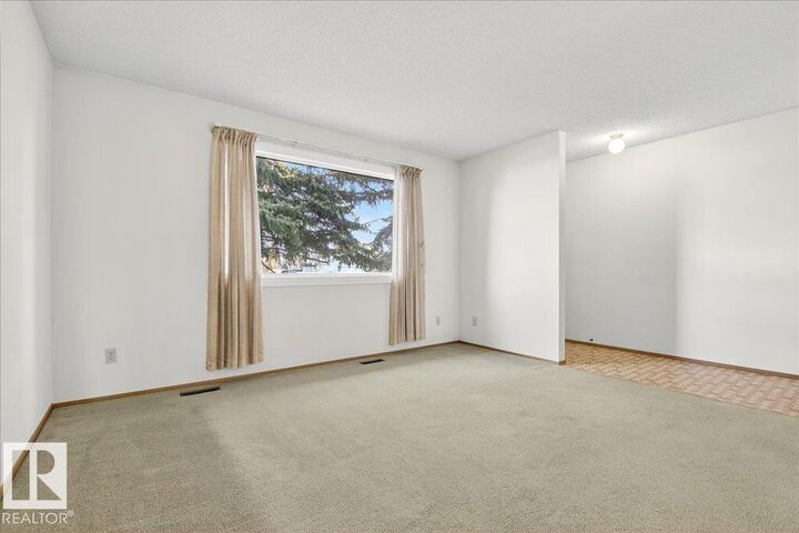 Property Photo:  5712 188 Street NW  AB T6M 2A5 