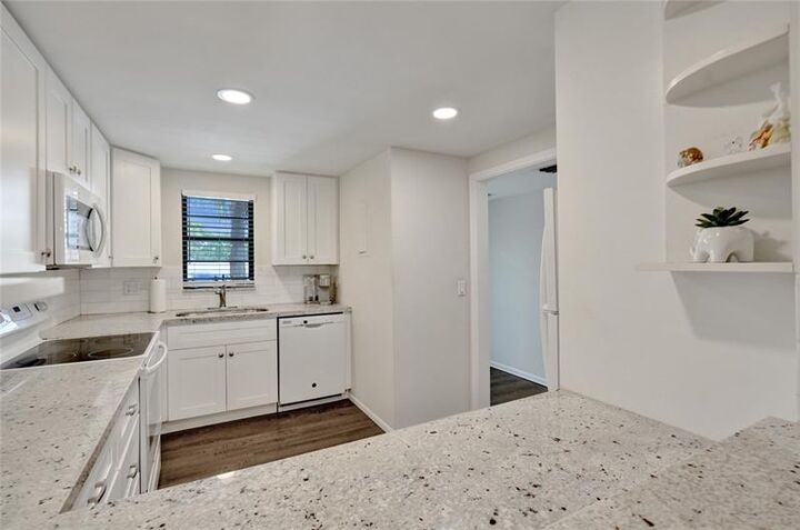 Property Photo:  2410 Deer Creek Country Club Blvd 202  FL 33442 