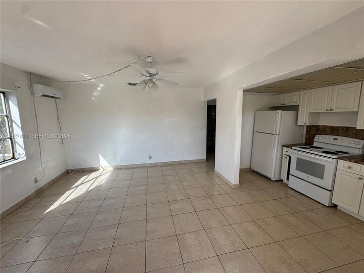 Property Photo:  1427 NE 56th St 1-7  FL 33334 