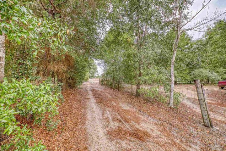 Property Photo:  10246 Nichols Lake Rd  FL 32583 