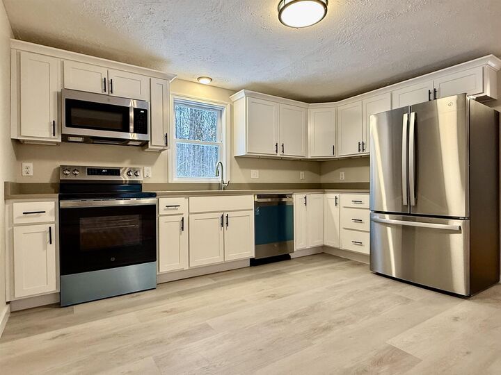 Property Photo:  69 Kullgren Road  NH 03084 