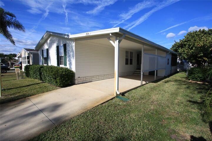 Property Photo:  318 Macadamia Drive  FL 32976 