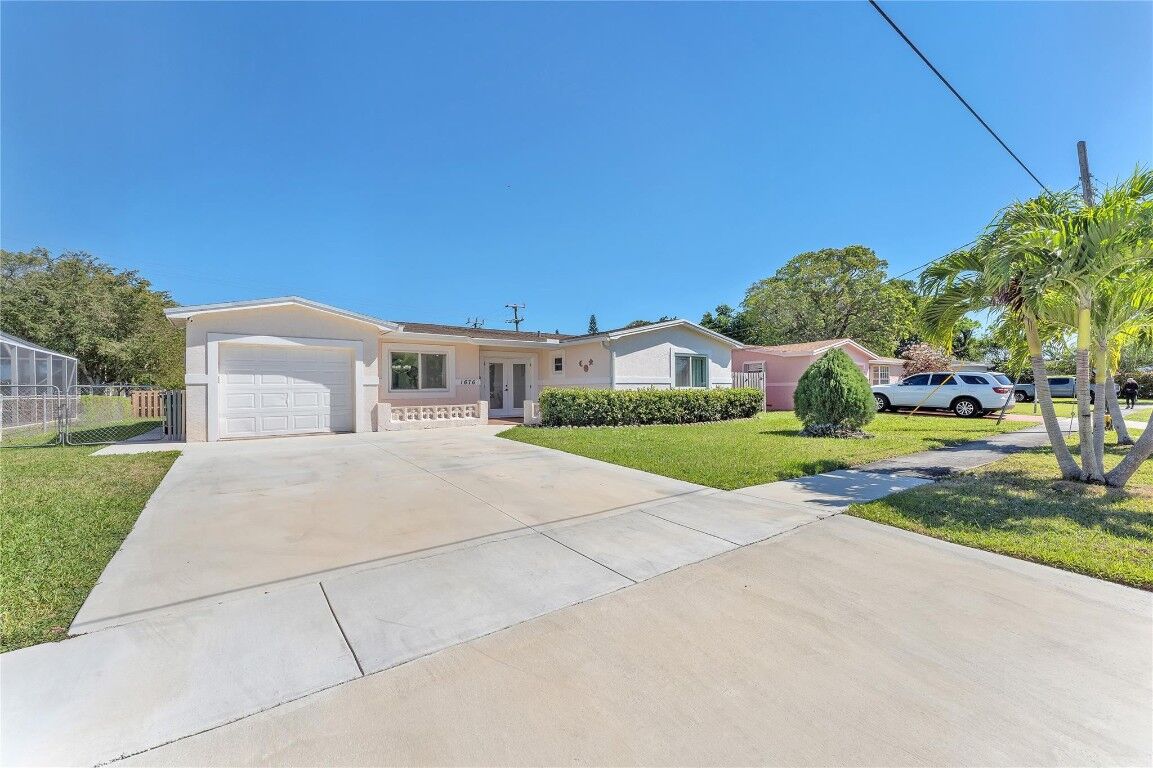 Property Photo:  1676 NW 65th Avenue  FL 33063 