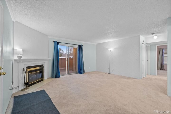 Property Photo:  3330 S Ammons Street 10-101  CO 80227 
