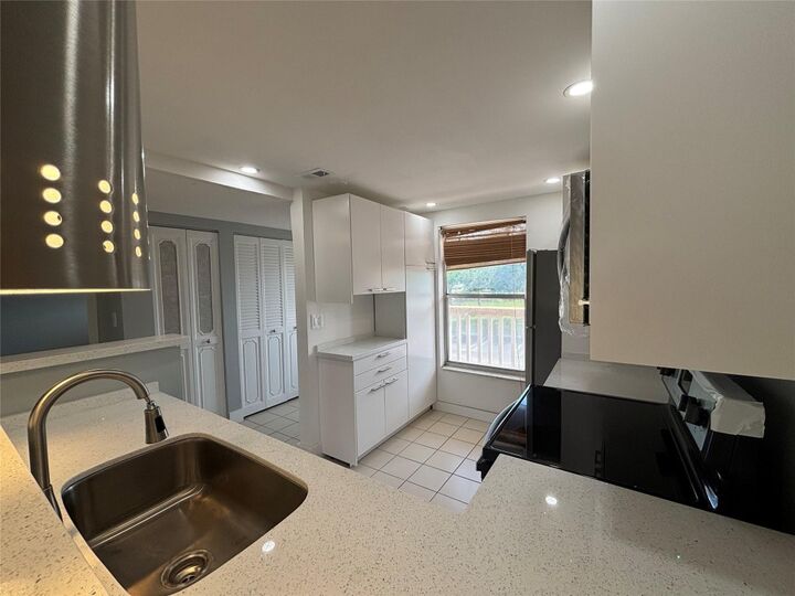 Property Photo:  6000 NW 64th Avenue 211  FL 33319 