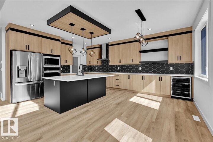 Property Photo:  1119 Gyrfalcon Crescent NW  AB T5S 0S5 