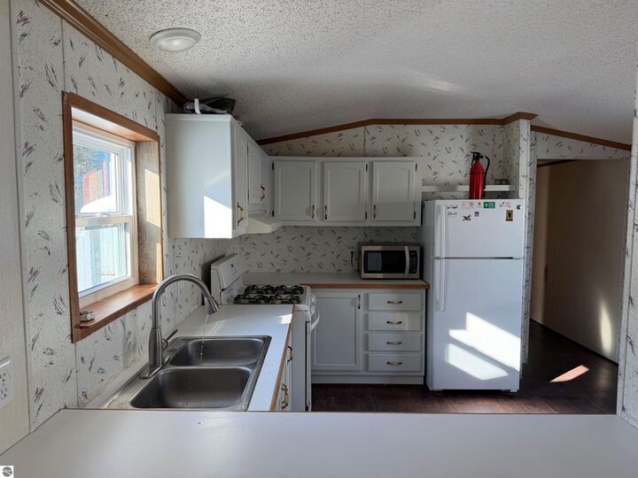 Property Photo:  6685 M-66 North #51  MI 49720 