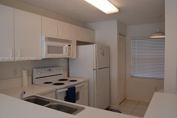 Property Photo: 14057 SW 121st Pl 7-24 FL 33186