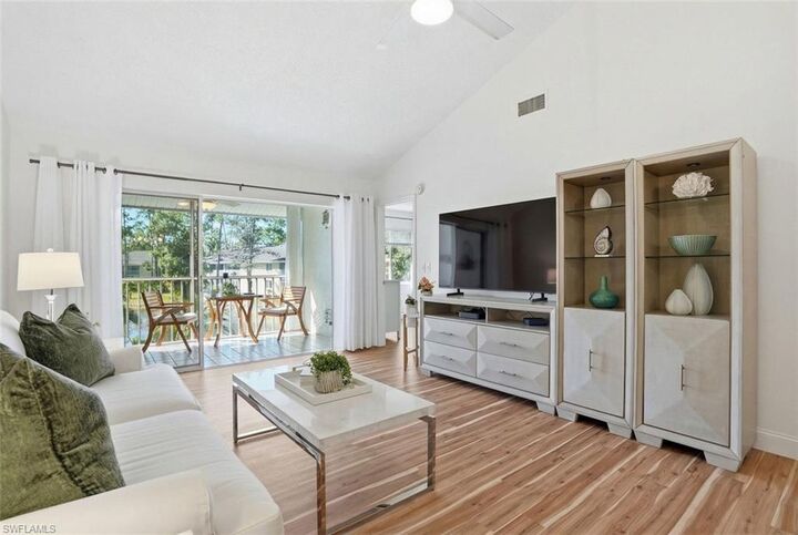 Property Photo:  5654 Woodmere Lake Cir C203  FL 34112 