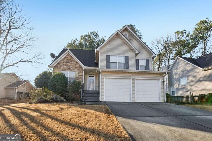 Property Photo:  1620 Rushing River Way  GA 30024 