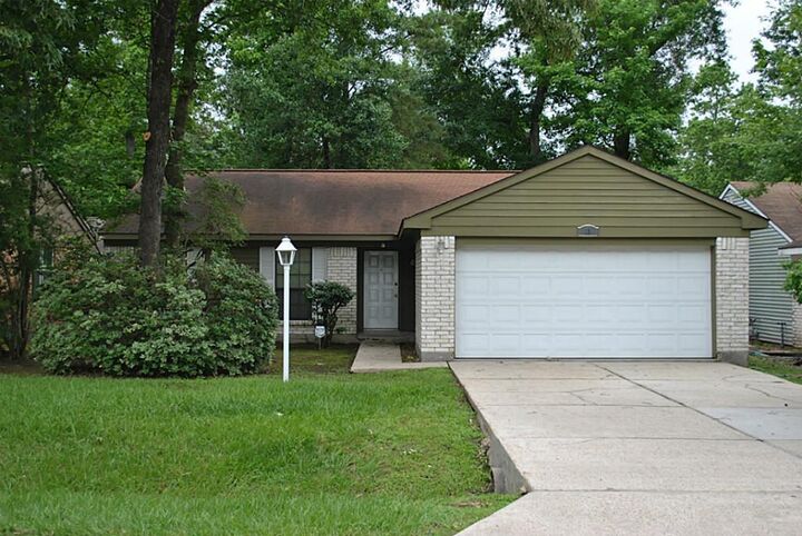 Property Photo:  18 Dellforest Court  TX 77381 