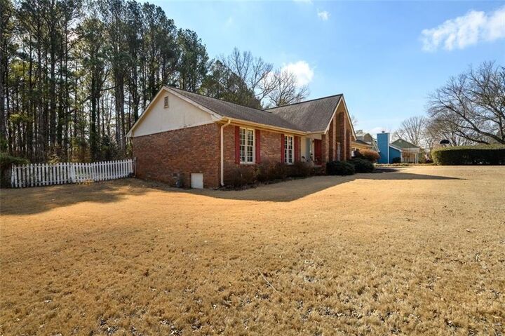 Property Photo:  4304 Riverside Drive SW  GA 30047 