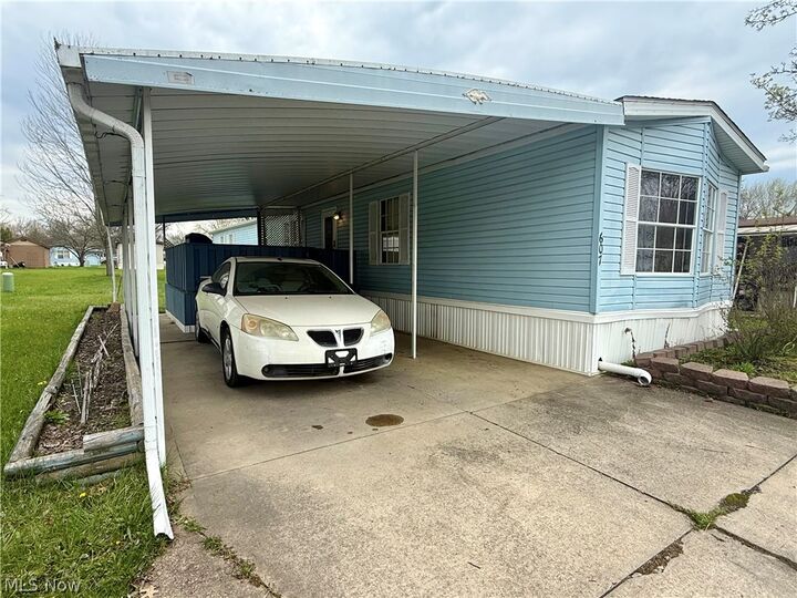 Property Photo:  607 Sugar Pines Drive SW  OH 44076 