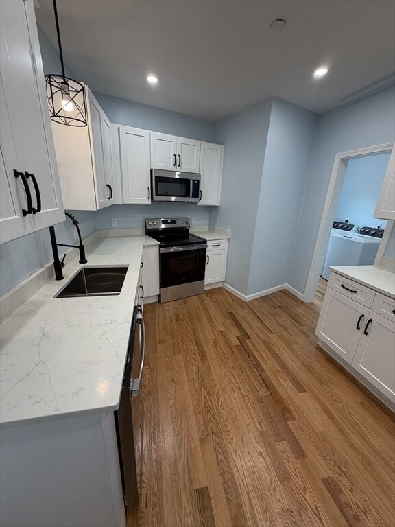 Property Photo:  57 Oak Island St 1  MA 02151 