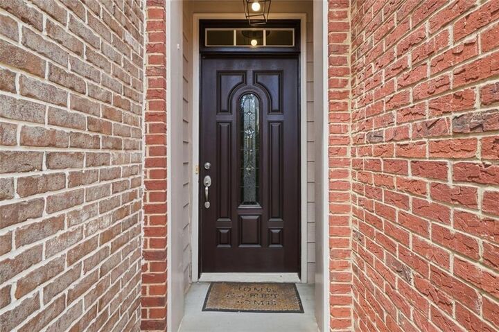 Property Photo:  1114 Firethorne Pass  GA 30040 