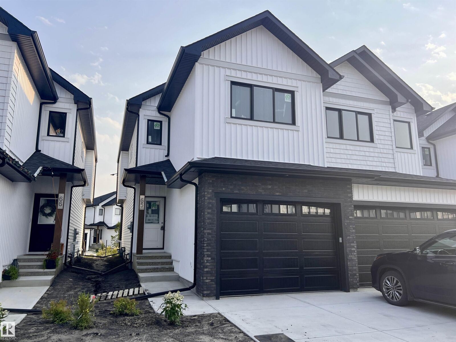 Property Photo: 5122 213A Street NW 65 AB T6M 1M6