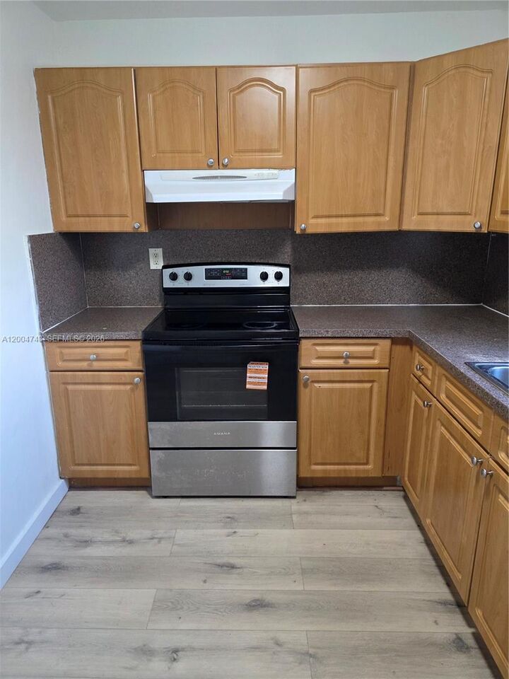 Property Photo:  1111 NW 19th Ave 205  FL 33125 