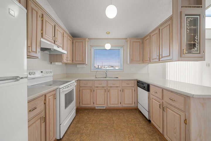 Property Photo:  99 Arbour Lake Road NW 299  AB T3G 4E4 