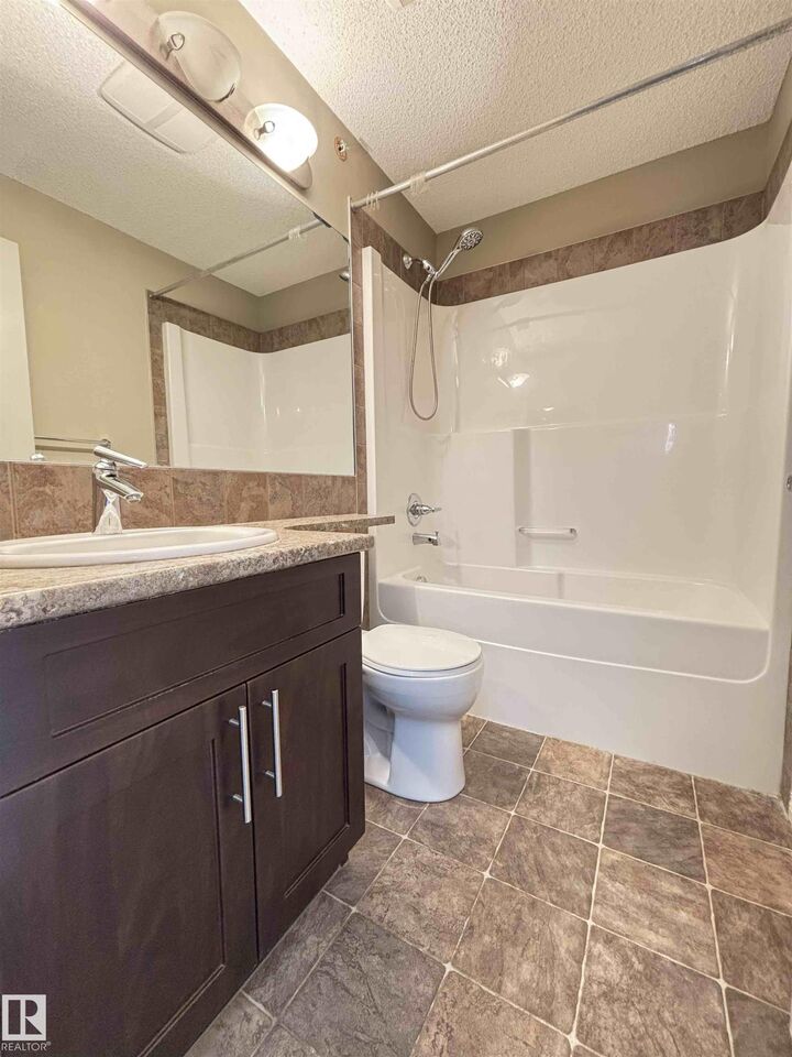Property Photo: 111 Ambelside Drive SW 408 AB T6W 0J4