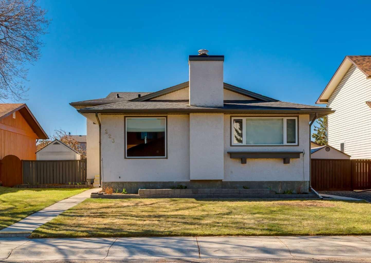 Property Photo:  223 Cedarwood Road SW  AB T2W 3G8 