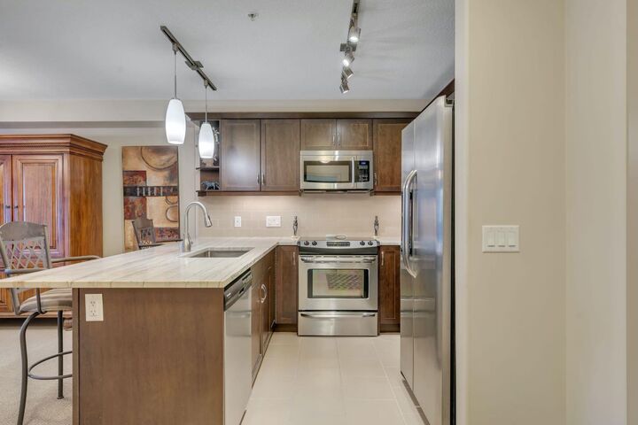 Property Photo:  310 McKenzie Towne Gate SE 3213  AB T2Z 1J4 