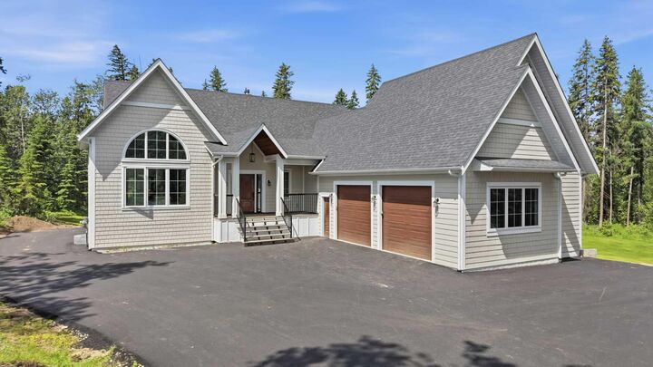 Property Photo: 1-260077 Twp Rd 422 AB T4J 1R3