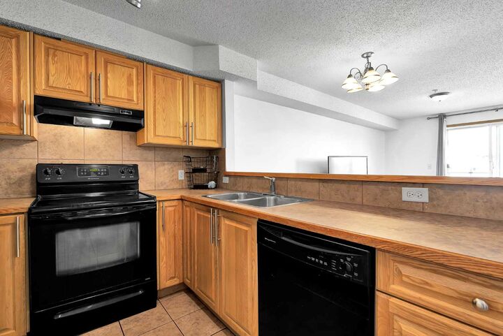 Property Photo:  92 Saddletree Court NE 218  AB T3J 0K9 